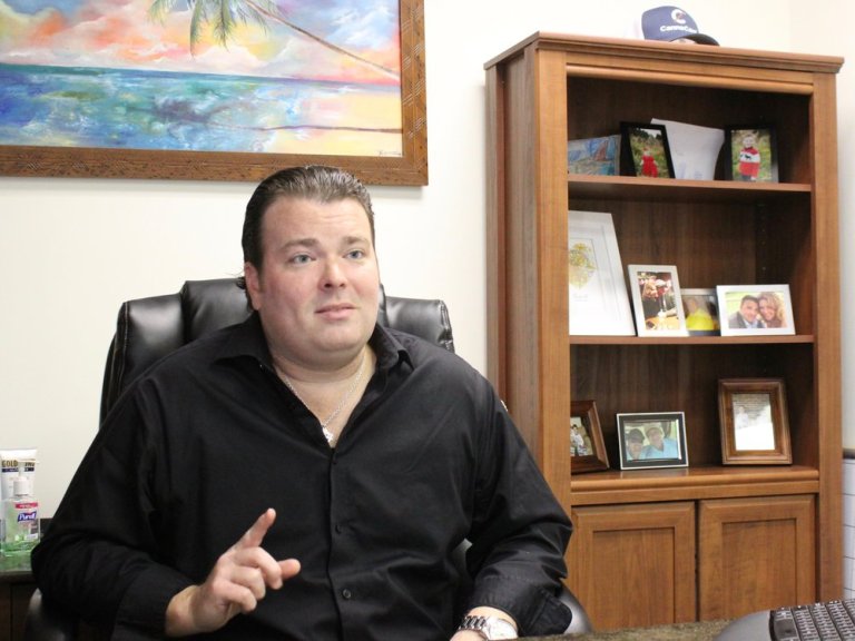 Tom Gavin IV talks about the CannaCard at the CannaTrac offices in suburban Palos Heights. (One Illinois/Ted Cox)