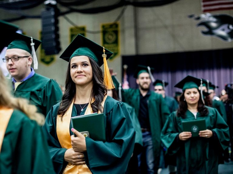 Graduates collect their diplomas at the 50th College of DuPage commencement two years ago. (Flickr/College of DuPage Newsroom)