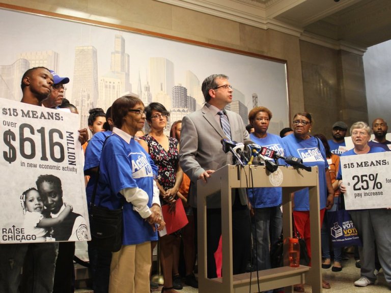 Former Chicago Alderman John Arena speaks at a protest five years ago calling for the city to hike its minimum wage to $15 an hour. (One Illinois/Ted Cox)