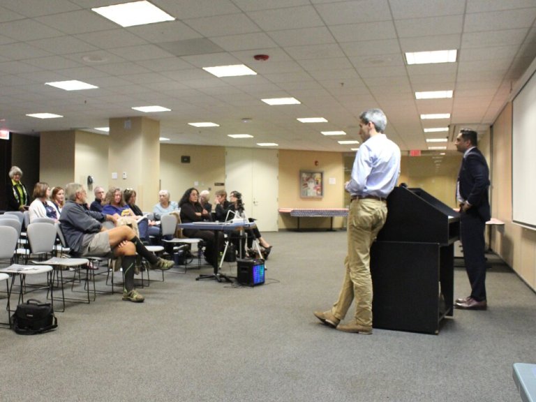 Daniel Biss and Ameya Pawar address Indivisible Naperville Wednesday night. (One Illinois/Ted Cox)