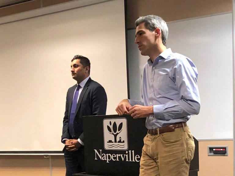 Ameya Pawar and Daniel Biss address Indivisible Naperville Wednesday night. “How do we make sure that our investments are aligned with our priorities?” Pawar said. (One Illinois/Ted Cox)
